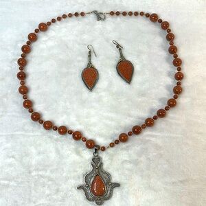 Goldstone necklace and dangle earring set.